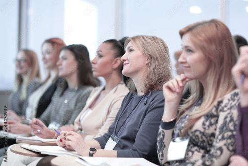 ladies looking at talk with notepad