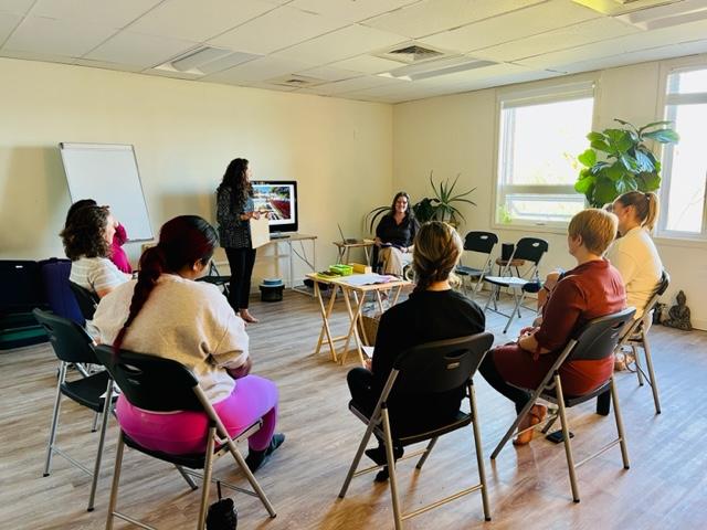 Jen speaking to a group